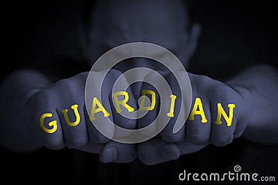 GUARDIAN written on an angry manâ€™s fists Stock Photo